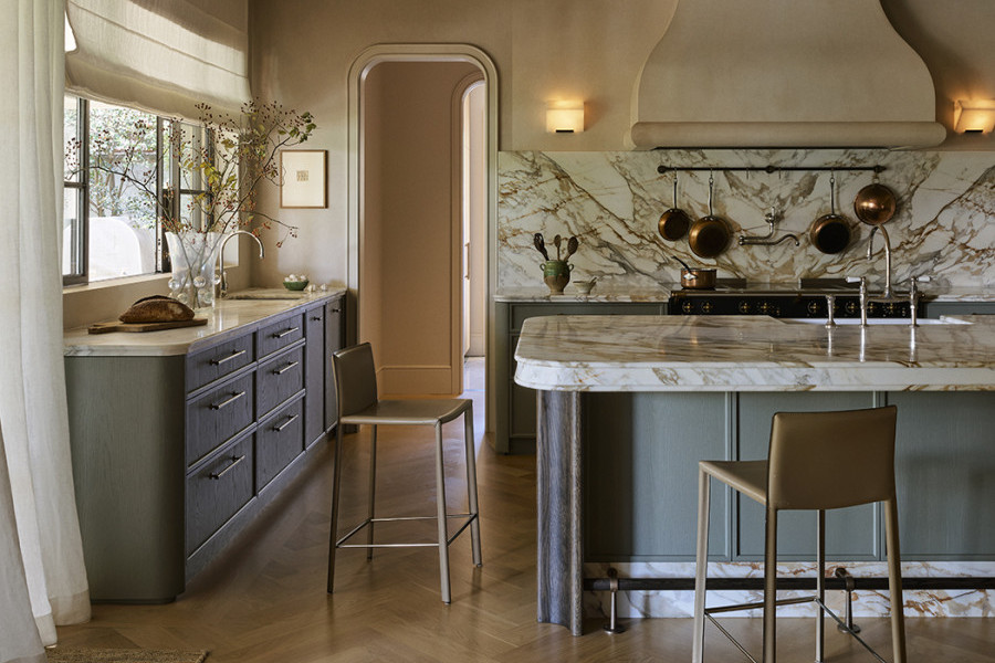 A kitchen with marble bench and Perrin & Rowe tapware. 