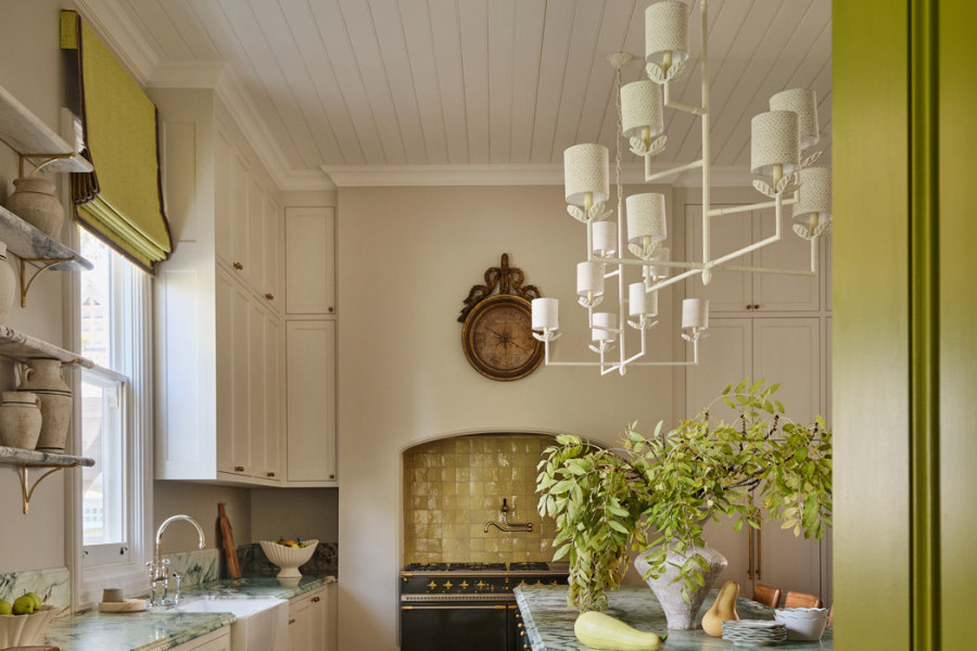 Heritage-style kitchen in Warrnambool with marble benchtops, Perrin & Rowe tapware, handcrafted joinery, and citrus-accented walls and tiles.