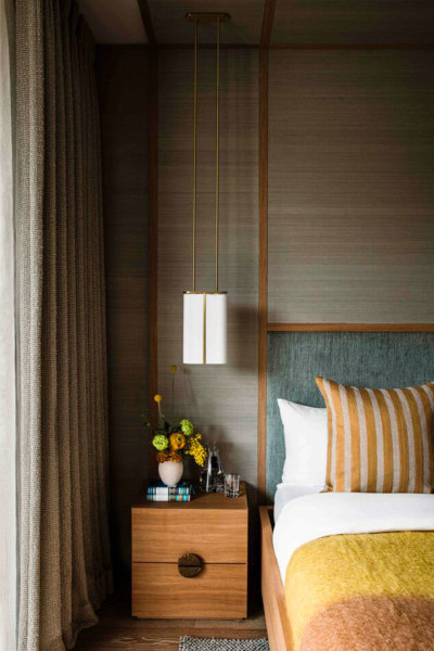 Bedside cabinet two drawers with half moon handles making a round shape. 