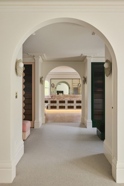 Novara master bathroom featuring polished nickel and pale pink Rockwell tapware, pink marble stone surfaces, and grey subway tiles, creating a sophisticated and romantic design.