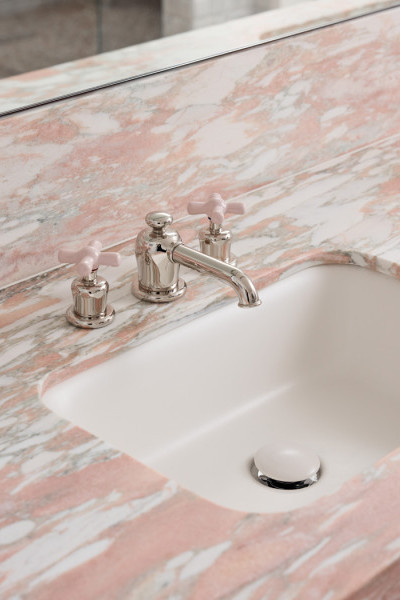 Novara master bathroom featuring polished nickel and pale pink Rockwell tapware, pink marble stone surfaces, and grey subway tiles, creating a sophisticated and romantic design.