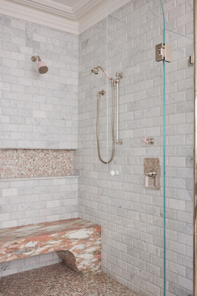 Novara master bathroom featuring polished nickel and pale pink Rockwell tapware, pink marble stone surfaces, and grey subway tiles, creating a sophisticated and romantic design.