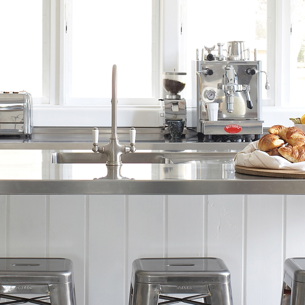 Phoenician 1 hole sink mixer with white porcelain lever taps