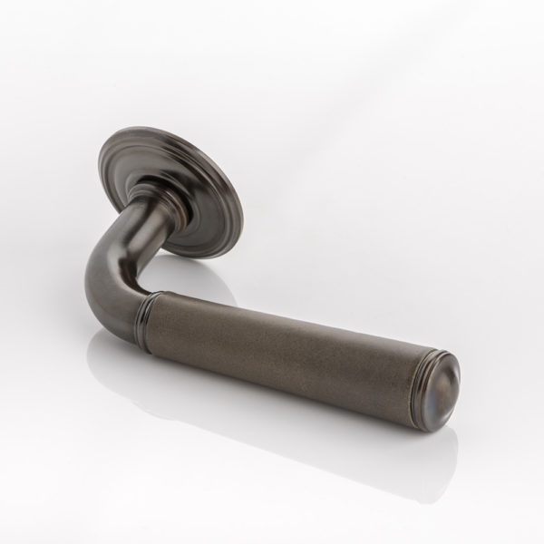 Darlington II solid brass door lever handle with hand stitched leather & ornate rose