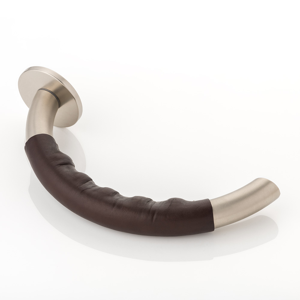 Infinity II solid brass door lever handle with hand stitched leather & round rose