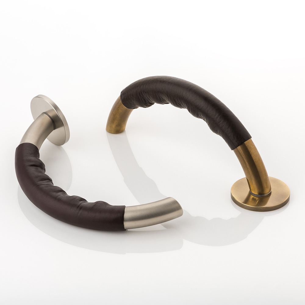 Infinity II solid brass door lever handle with hand stitched leather & round rose