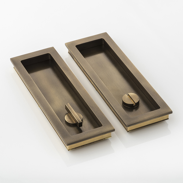 Rectangular solid brass recessed pull with privacy turn/release