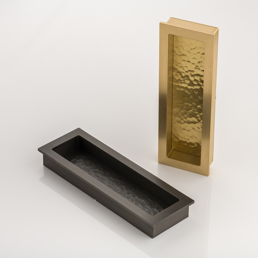 Rectangular solid brass recessed pull with hammered texture
